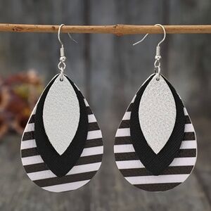 Women’s brand new, never worn black and white striped earrings